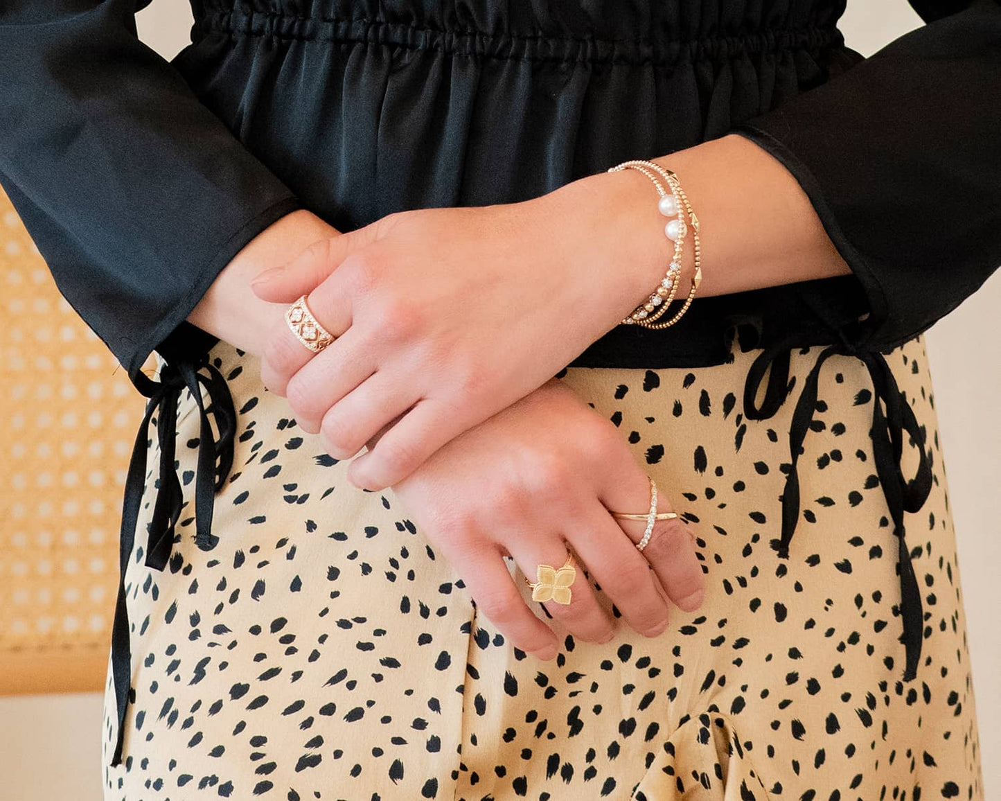 woman wearing multiple diamond rings and bracelets
