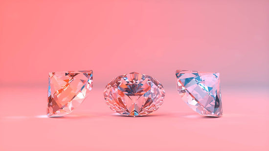 Photo of 3 diamonds in front of pink backdrop