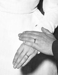 A married couples hands and rings on their wedding day