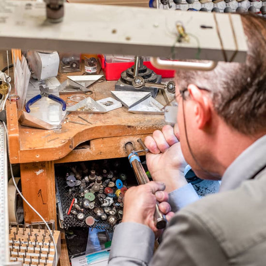 Jeweler repairing a timeless piece of jewelry
