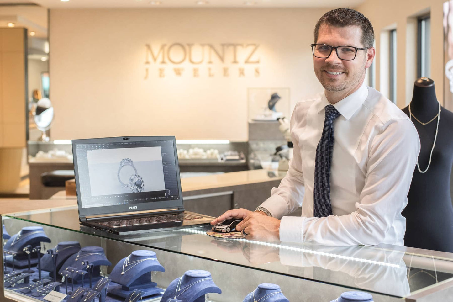 Jake at Mountz Jewelers shows off a custom design CAD image